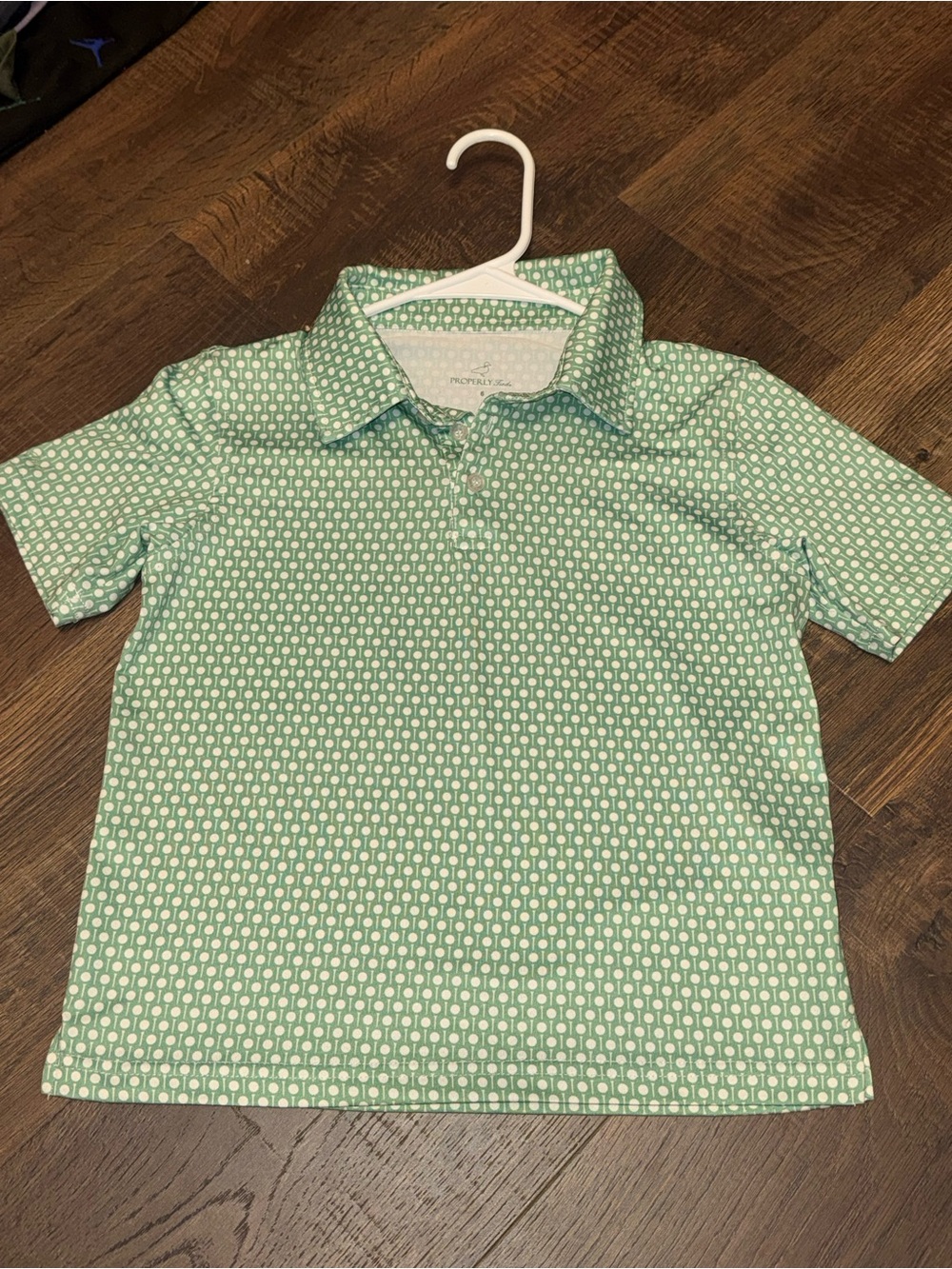 Boys' Green Golf Polo Shirt Properly Tied